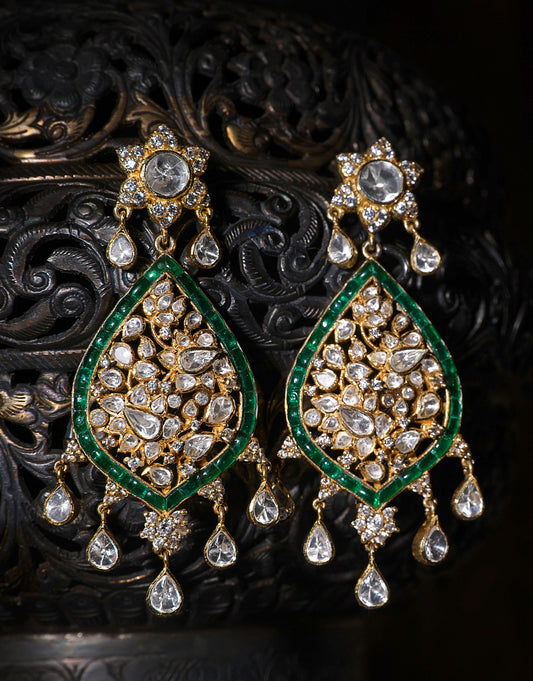 Featuring a pair of 18kt Gold plated polki earring with green utrai set in 92.5 Silver