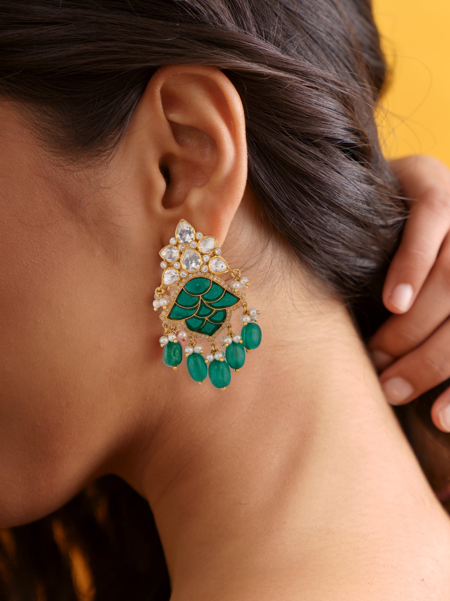 green emerald dangler earrings.