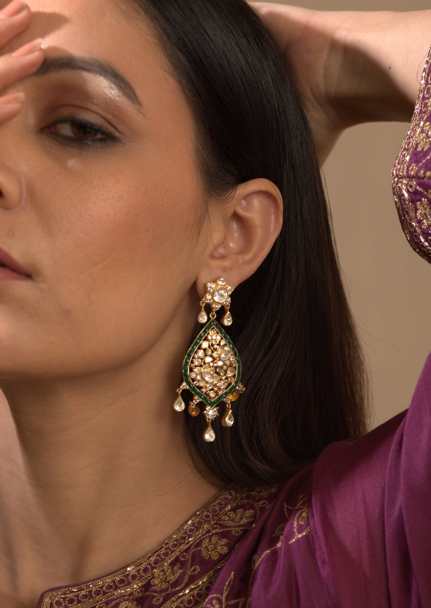 Featuring a pair of 18kt Gold plated polki earring with green utrai set in 92.5 Silver