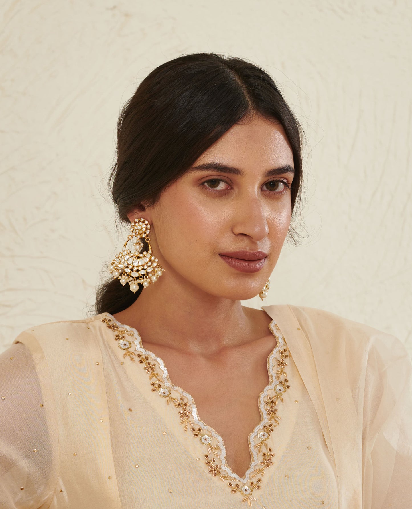 Featuring an 18kt gold plated 92.5 silver Vellore polki moon motif Chaandbali earring with fresh water pearls drops.