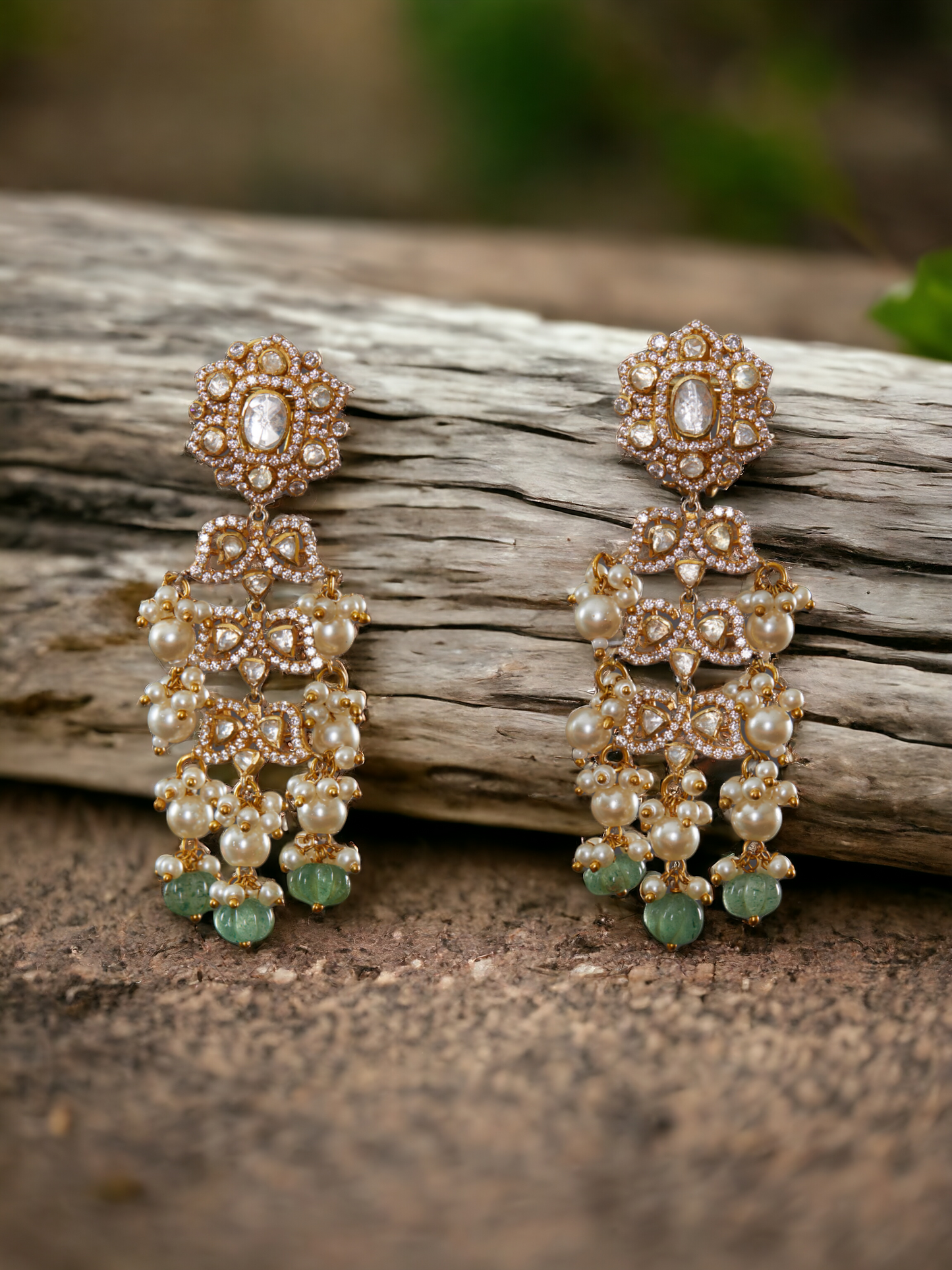92.5 silver Vellore polki leaf motif earring with green carved pumpkin drops & fresh water pearls.