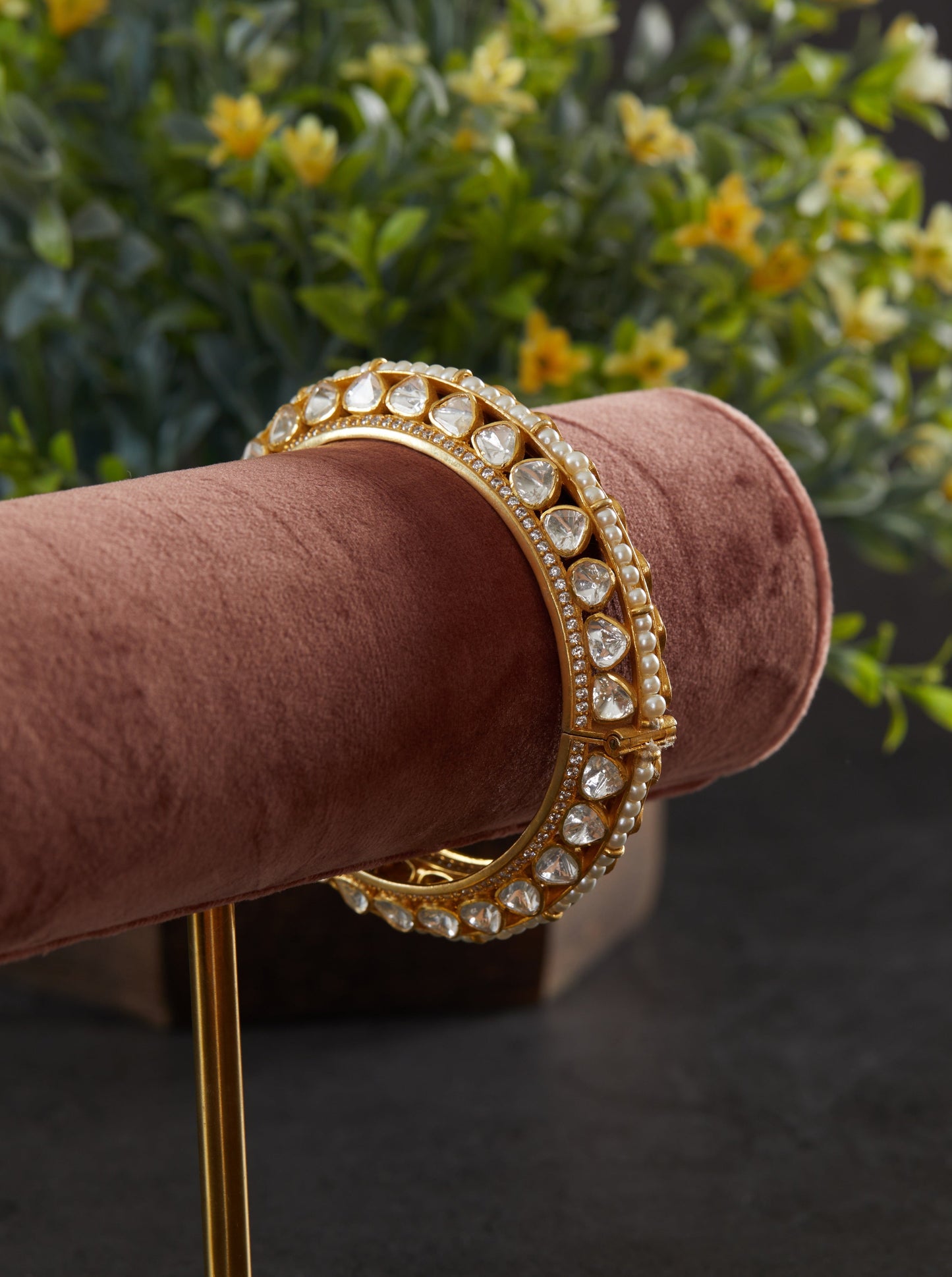Featuring an 18kt Gold Plated 92.5 silver moissanite 2 sided polki studded kada with pearl line in center.