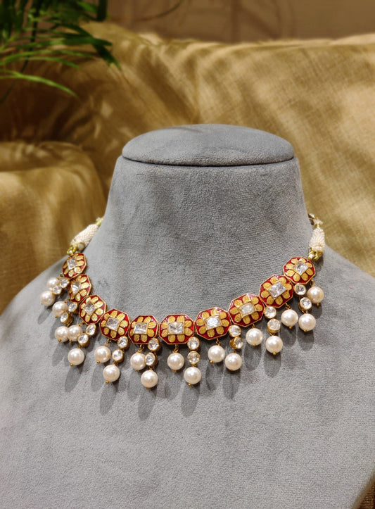 Featuring an 18kt Gold plated silver red enamel & polki floral texture necklace set in 92.5 Silver.