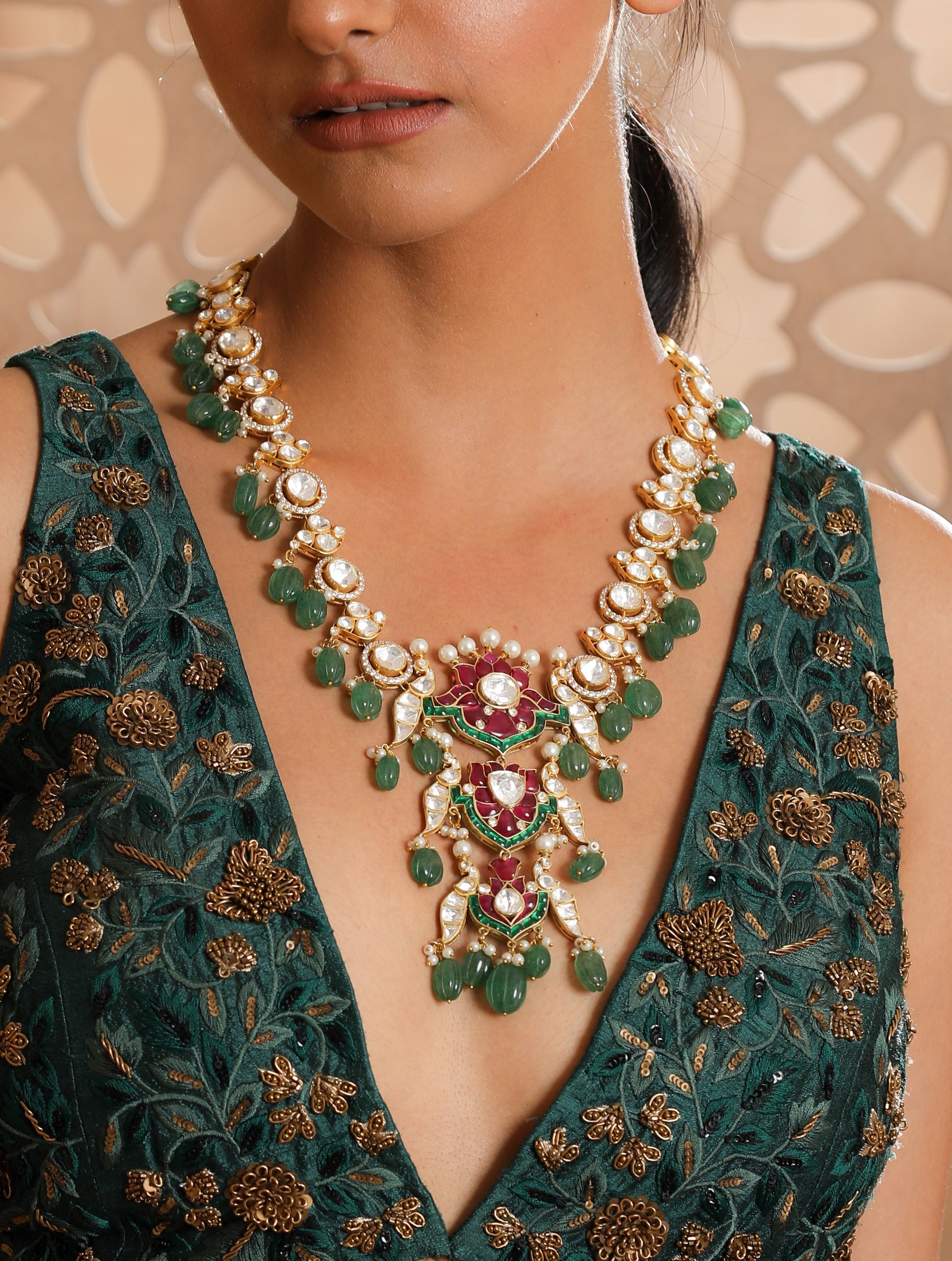 Featuring An 18kt Gold Plated Silver Moissanite Polki Bird Motif Long Necklace with Red and Green Utrai and Green Carved Drops.