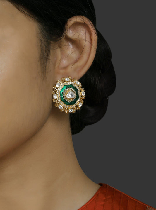 Featuring a pair of 18kt Gold plated studs with uncut polki and green enamel border with diamonds set in 92.5 Silver. 
