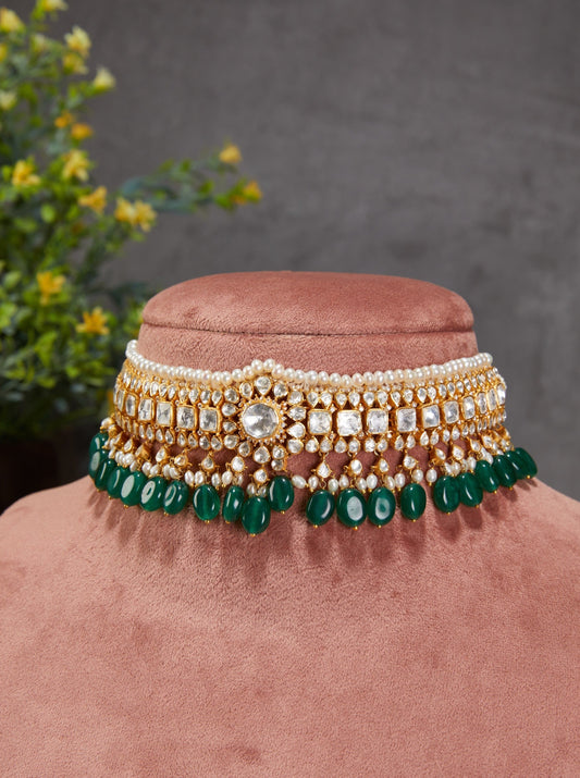 Featuring an 18kt gold plated 92.5 silver Vellore Polki choker with green drops and fresh water pearls.