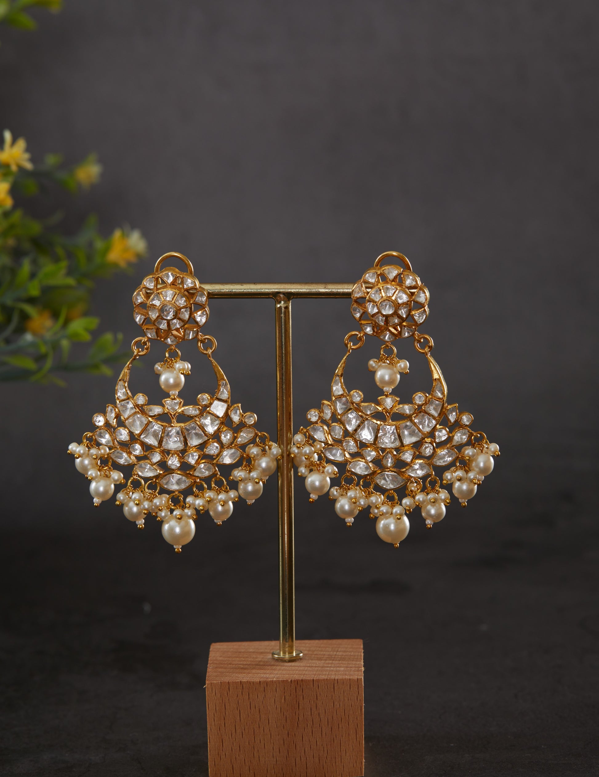 Featuring an 18kt gold plated 92.5 silver Vellore polki moon motif Chaandbali earring with fresh water pearls drops.