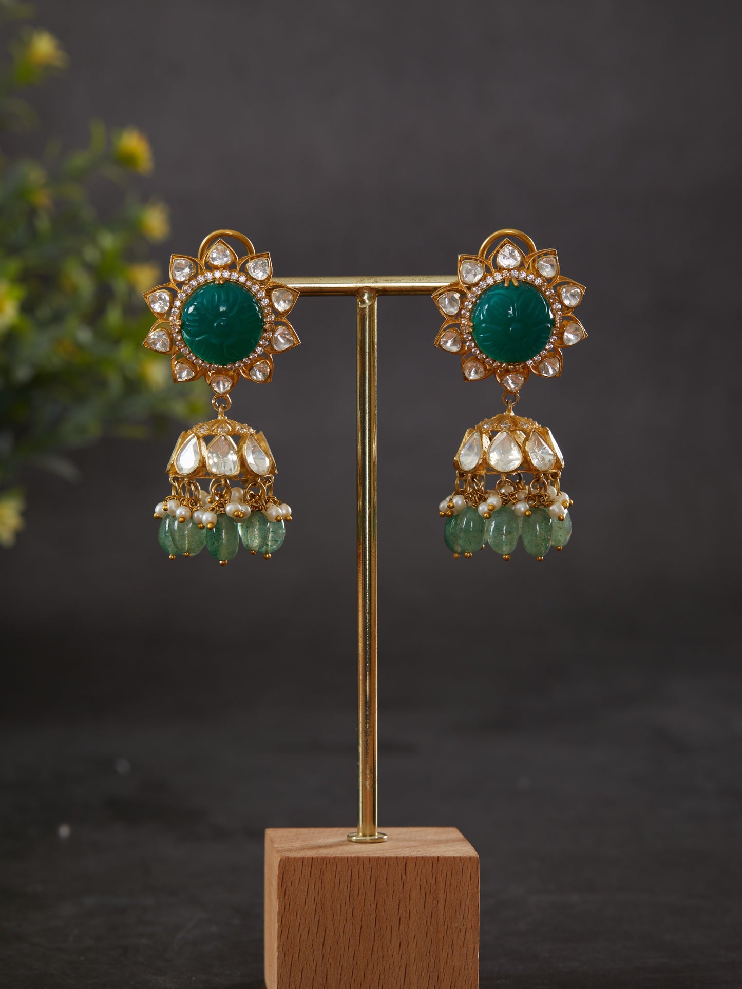 Featuring an 18kt gold plated 92.5 silver Vellore polki & Jhumkis with round green carved stone ear stud and pearl & green drops.