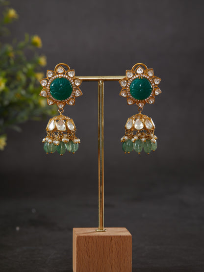 Featuring an 18kt gold plated 92.5 silver Vellore polki & Jhumkis with round green carved stone ear stud and pearl & green drops.