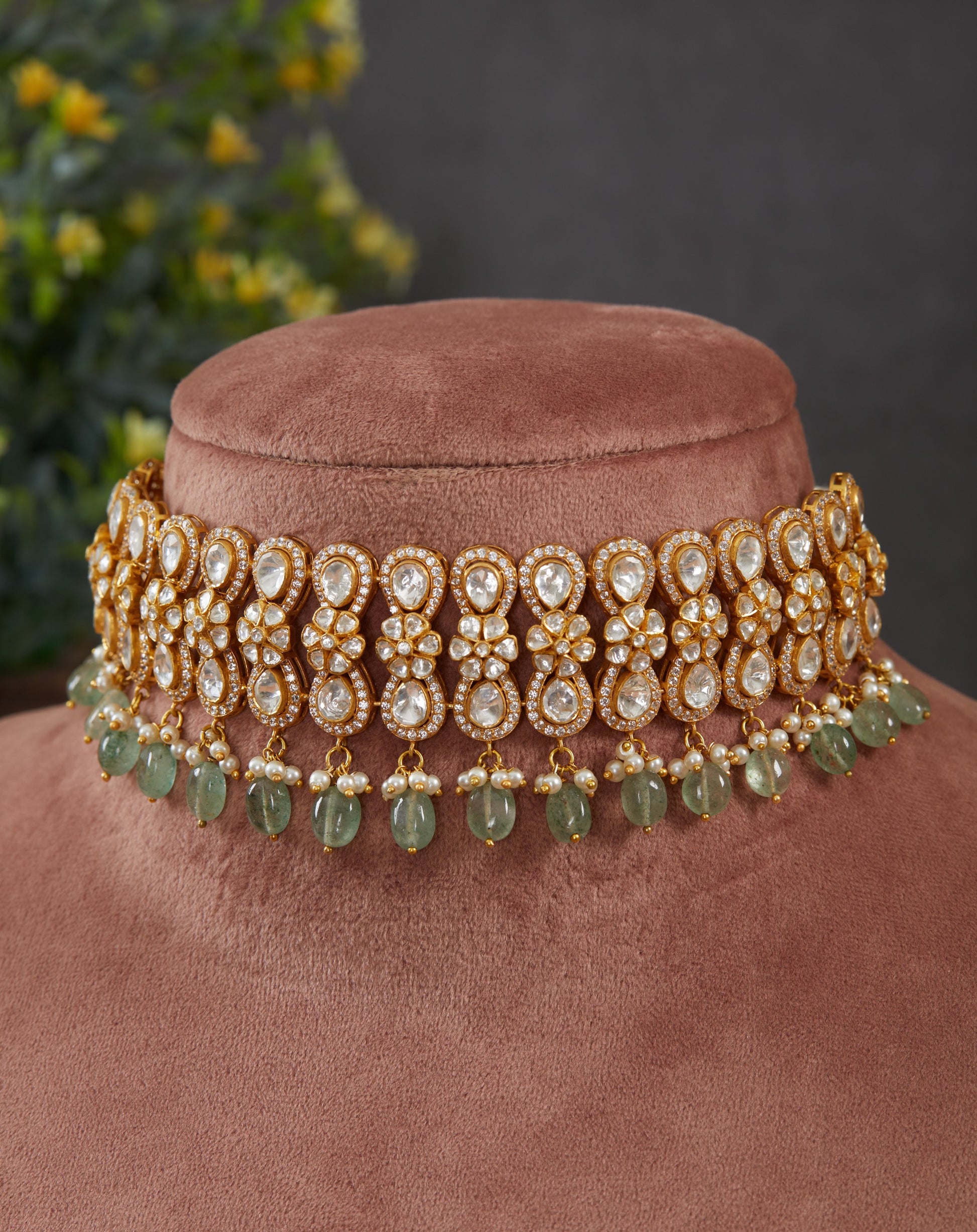 Featuring an 18kt gold plated 92.5 silver moissanite polki choker with green drops and fresh water pearls