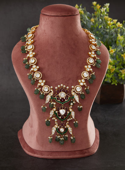 Featuring An 18kt Gold Plated Silver Moissanite Polki Bird Motif Long Necklace with Red and Green Utrai and Green Carved Drops.