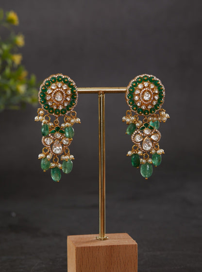 Vellore polki oval motif dangler earrings with green beads and drops.