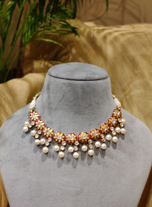 Featuring an 18kt Gold plated silver red enamel & polki floral texture  necklace set in 92.5 Silver. 